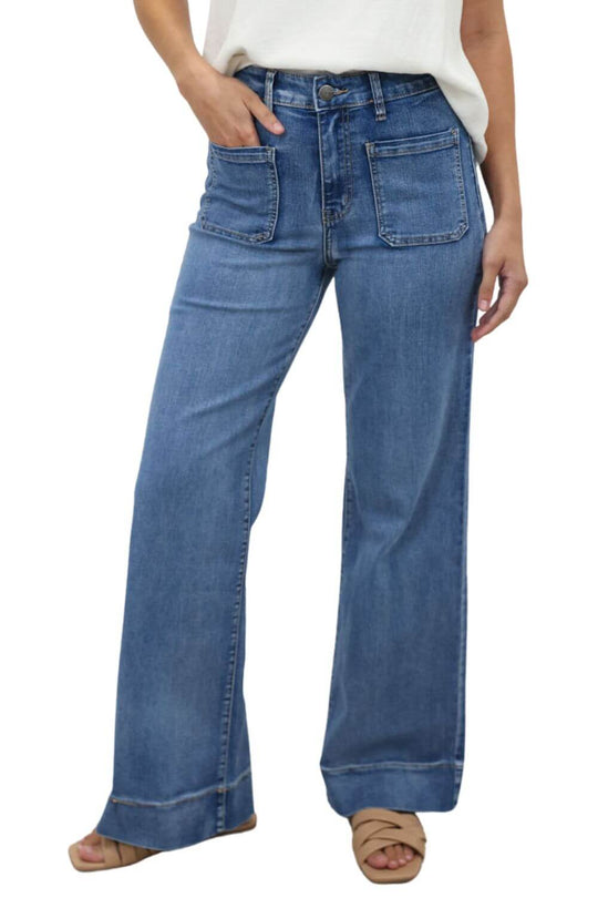 Model wearing high-waisted wide leg jeans with pockets from Vine Apparel