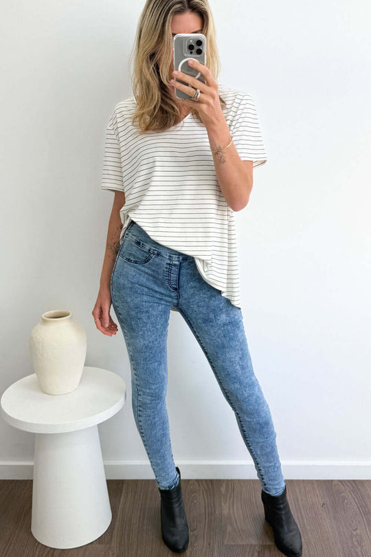 woman wearing denim size 8 skinny jeans