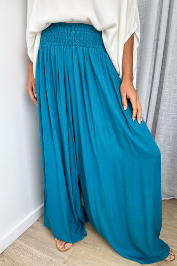 Teal: kym